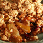 A plate with a generous serving of gluten-free Brandied Apple Crisp.