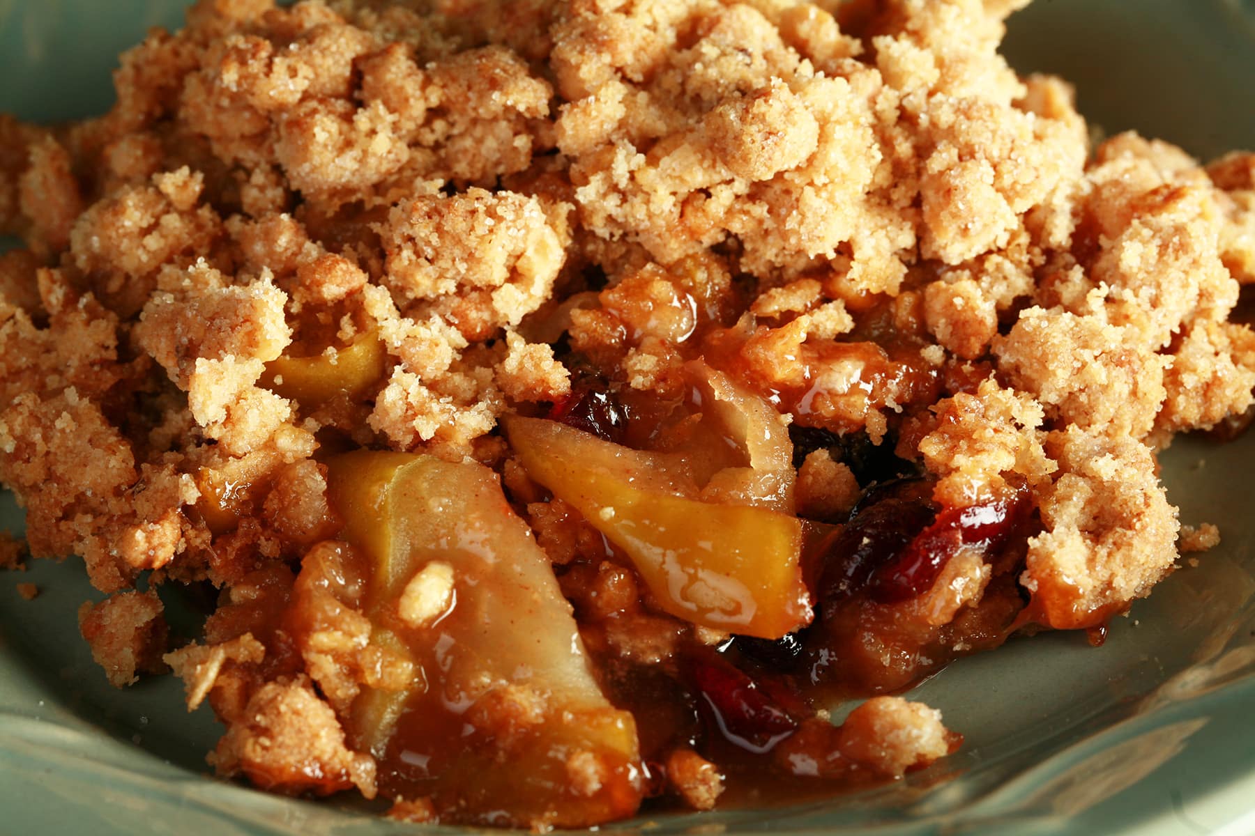 A plate with a generous serving of gluten-free Brandied Apple Crisp.
