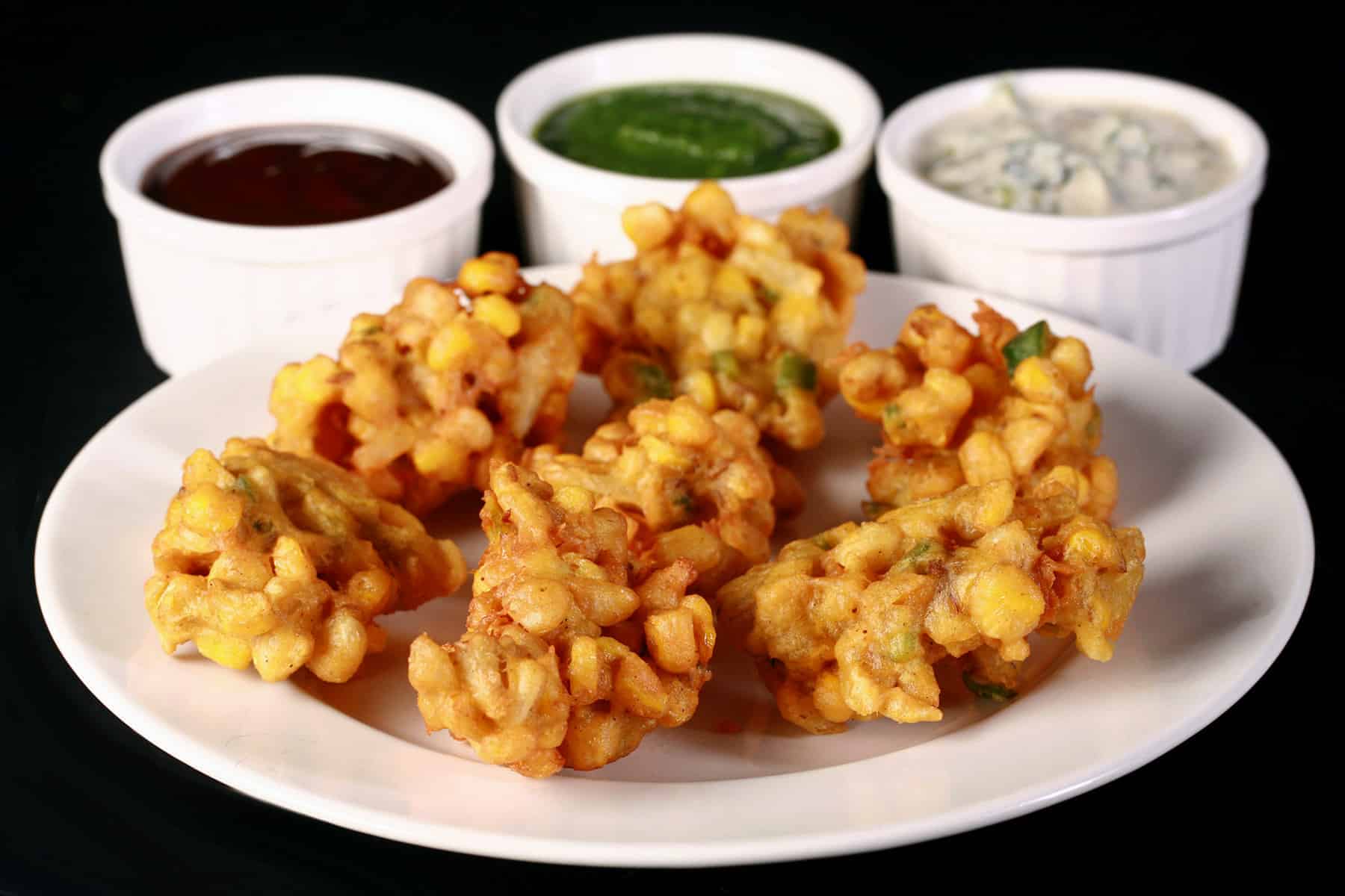 A plate of corn pakoras.