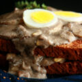 Gluten-Free Mushroom Soup and Eggs on Toast, garnished with hardboiled egg slices and thyme.