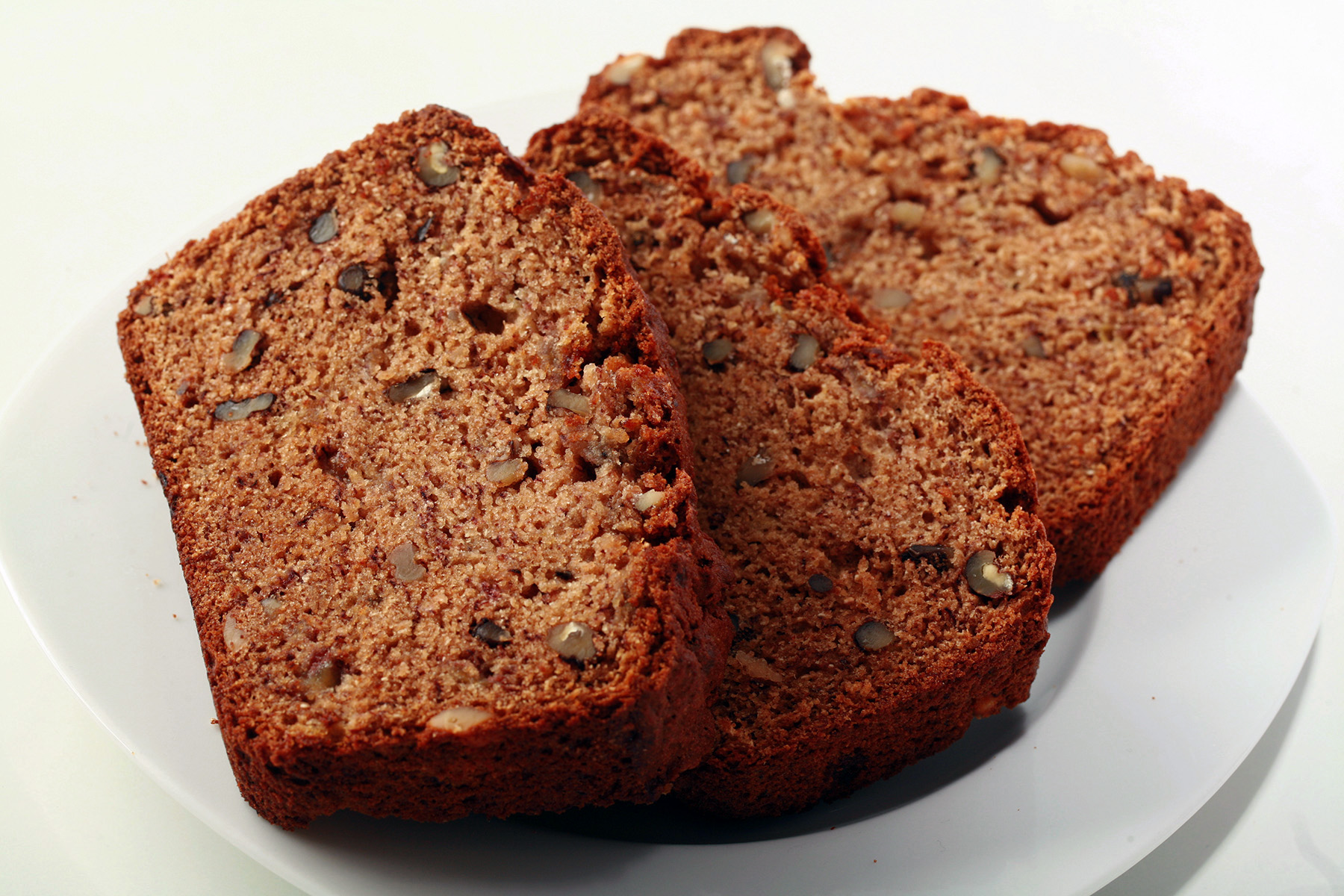 2 slices of gluten-free banana bread on a plate.