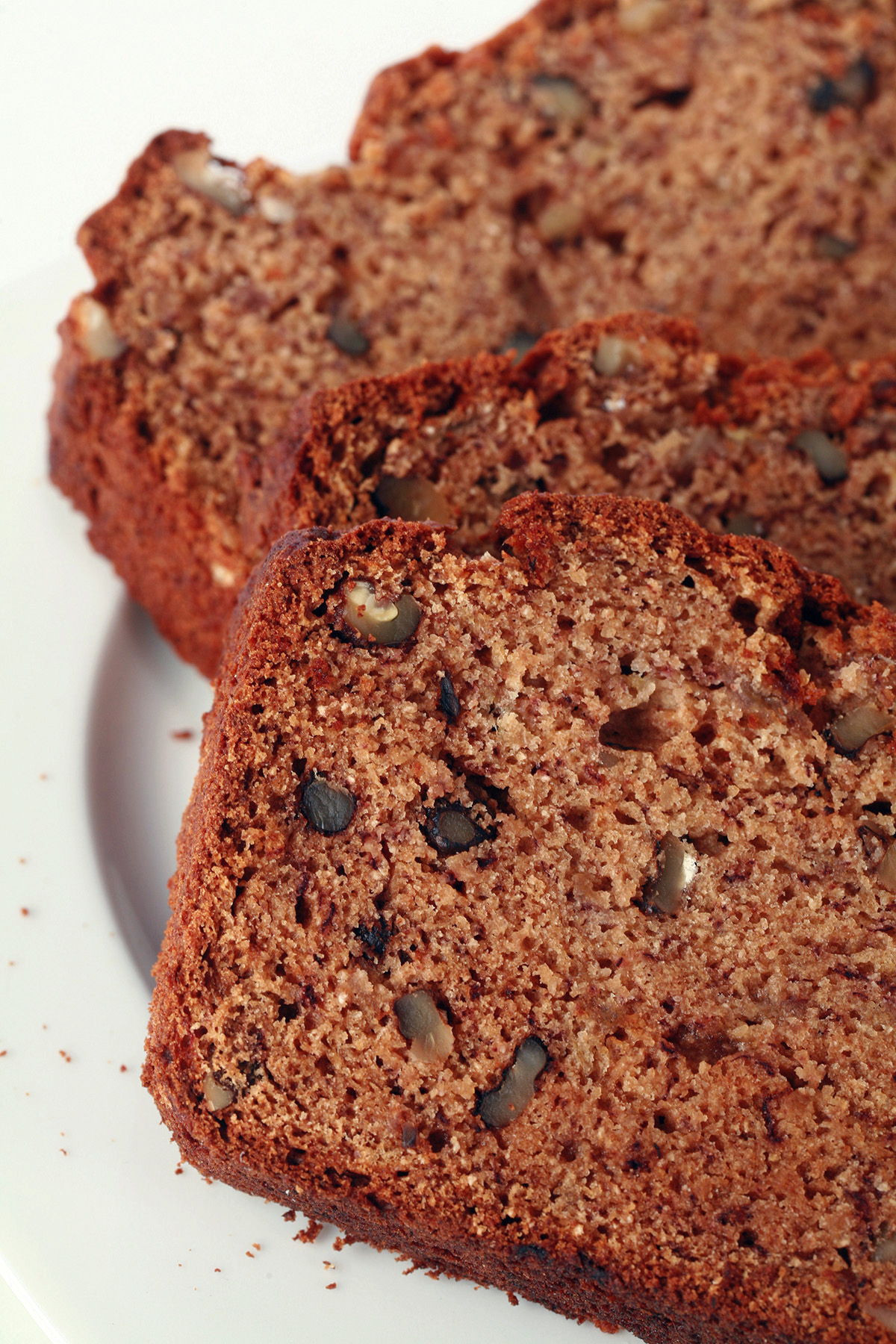 2 slices of gluten-free banana bread on a plate.