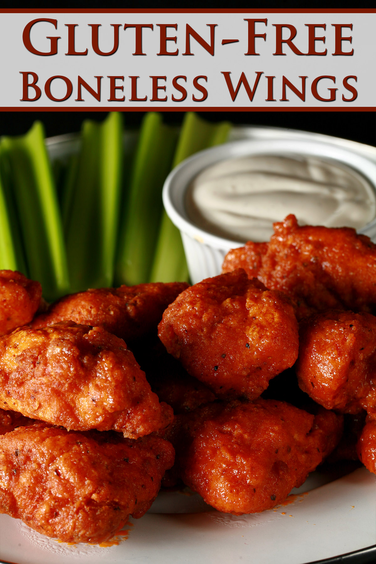 A plate of deep fried gluten-free boneless wings, celery, and dip.