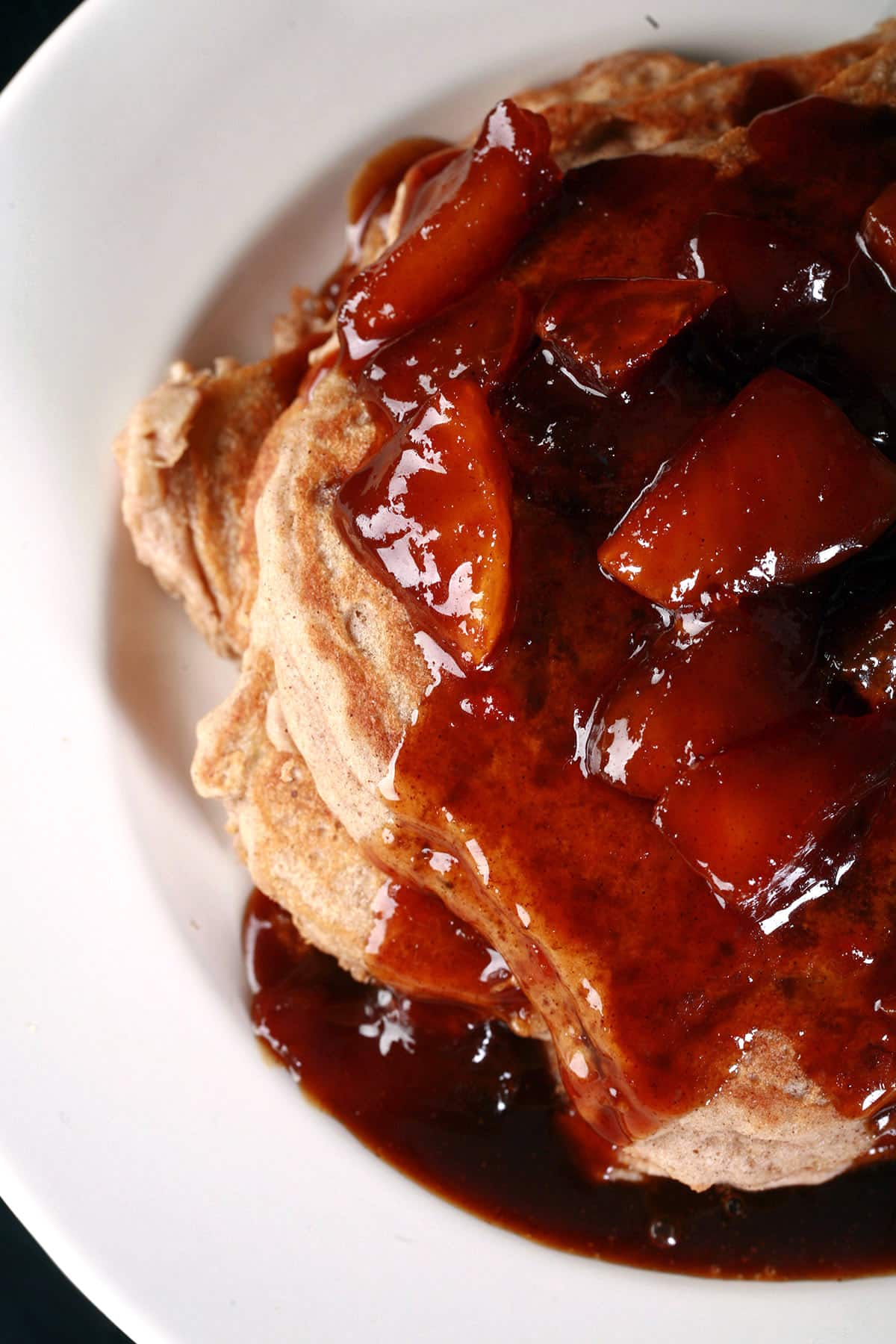 A stack of gluten free caramel apple pancakes.