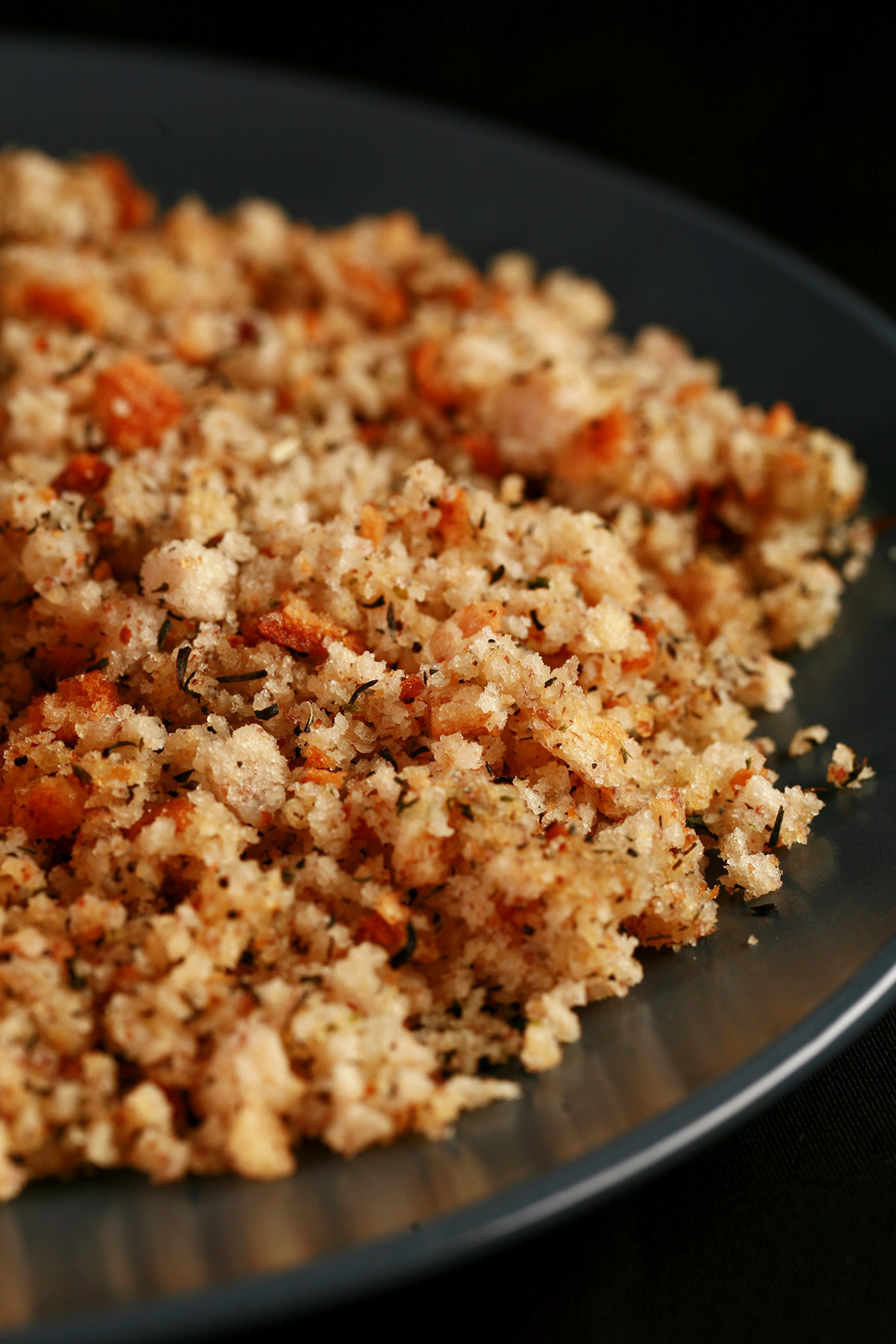 A mound of gluten-free dressing, on a blue plate.