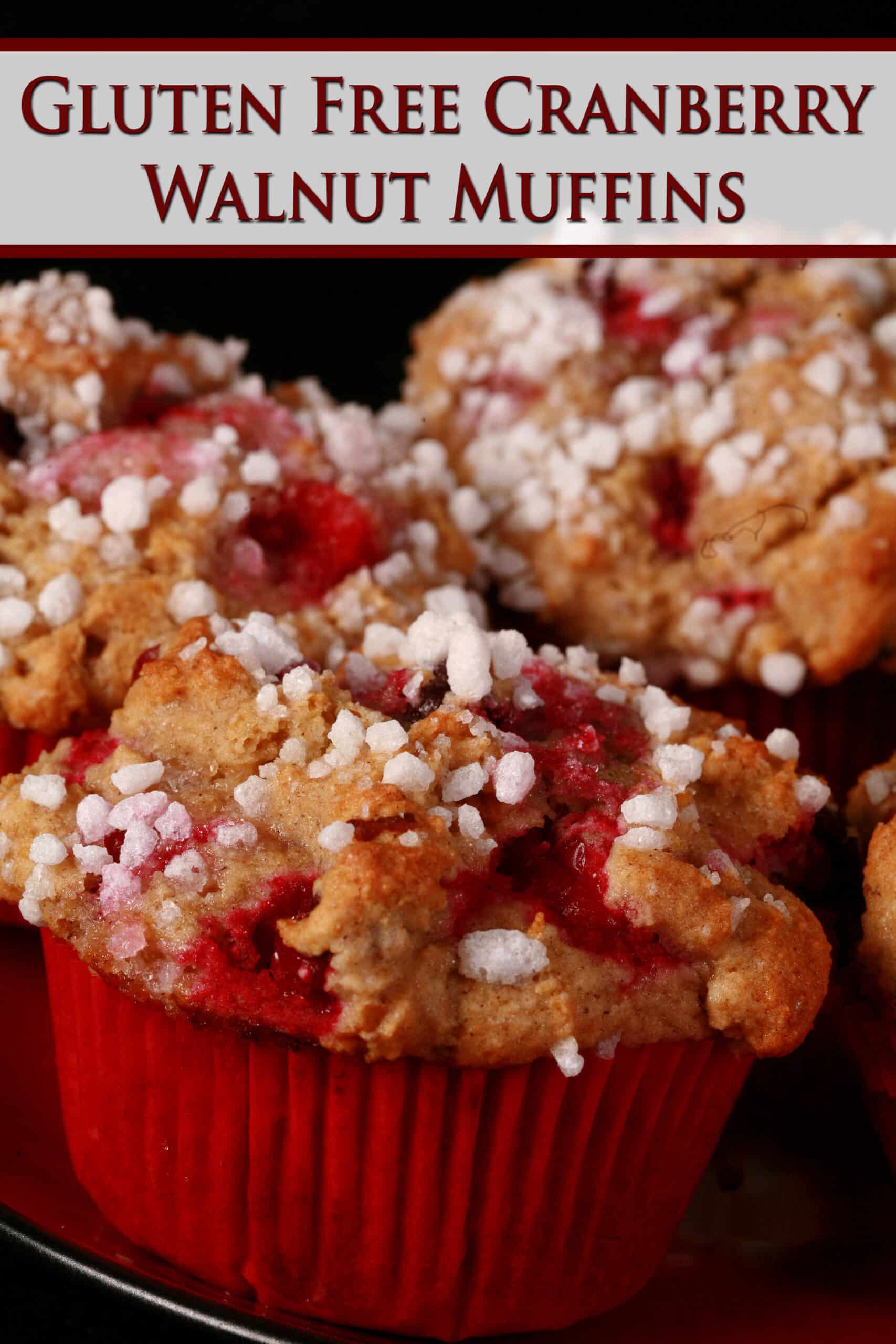 A plate of gluten-free cranberry muffins with sugar on top. Overlaid text says gluten free cranberry walnut muffins.