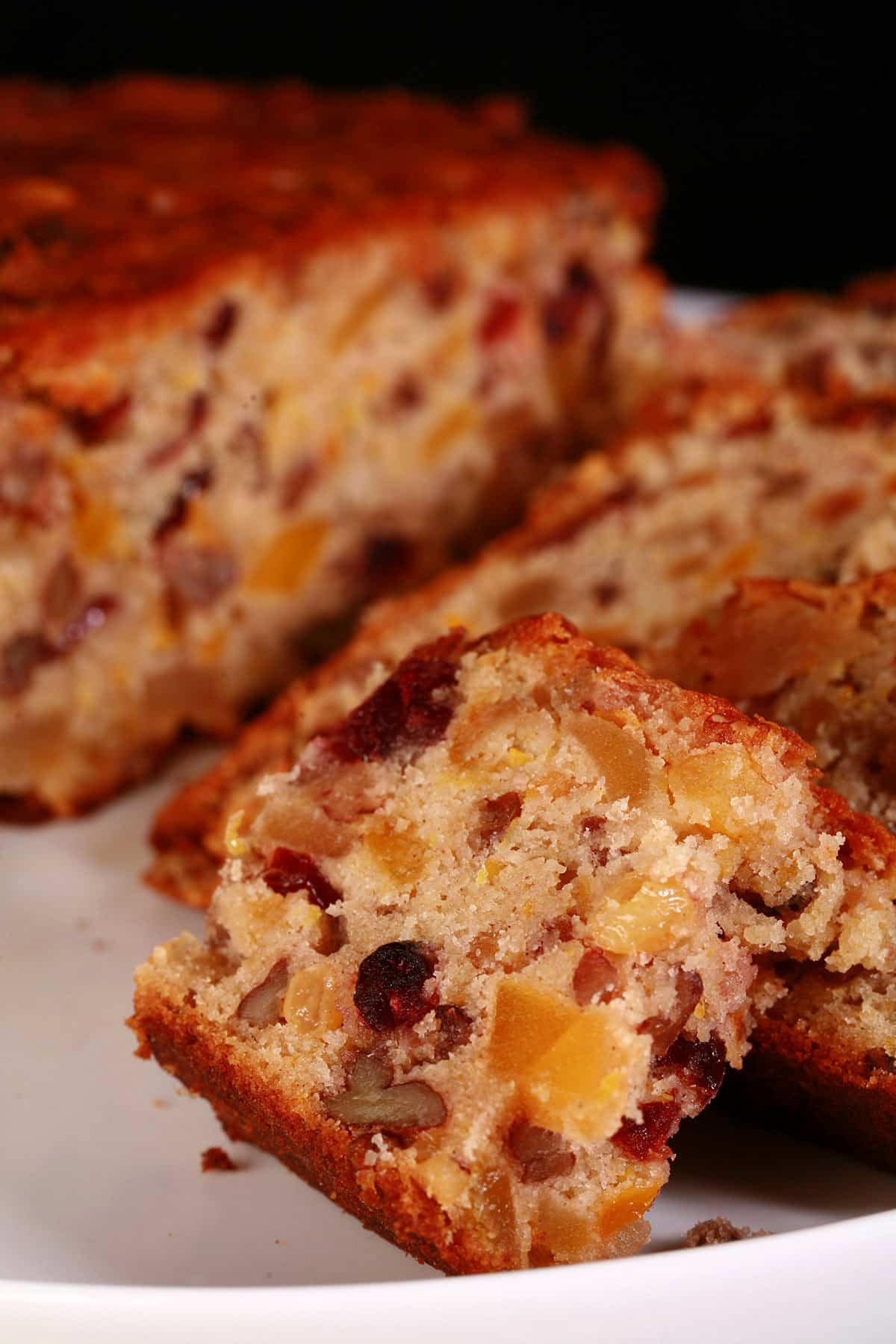 A sliced up gluten-free fruitcake.