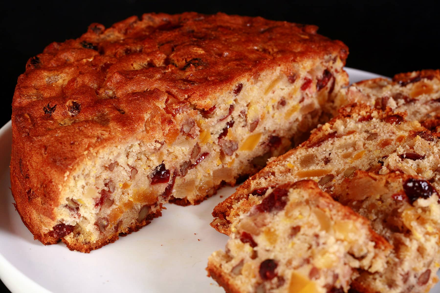 A sliced up gluten free fruitcake.
