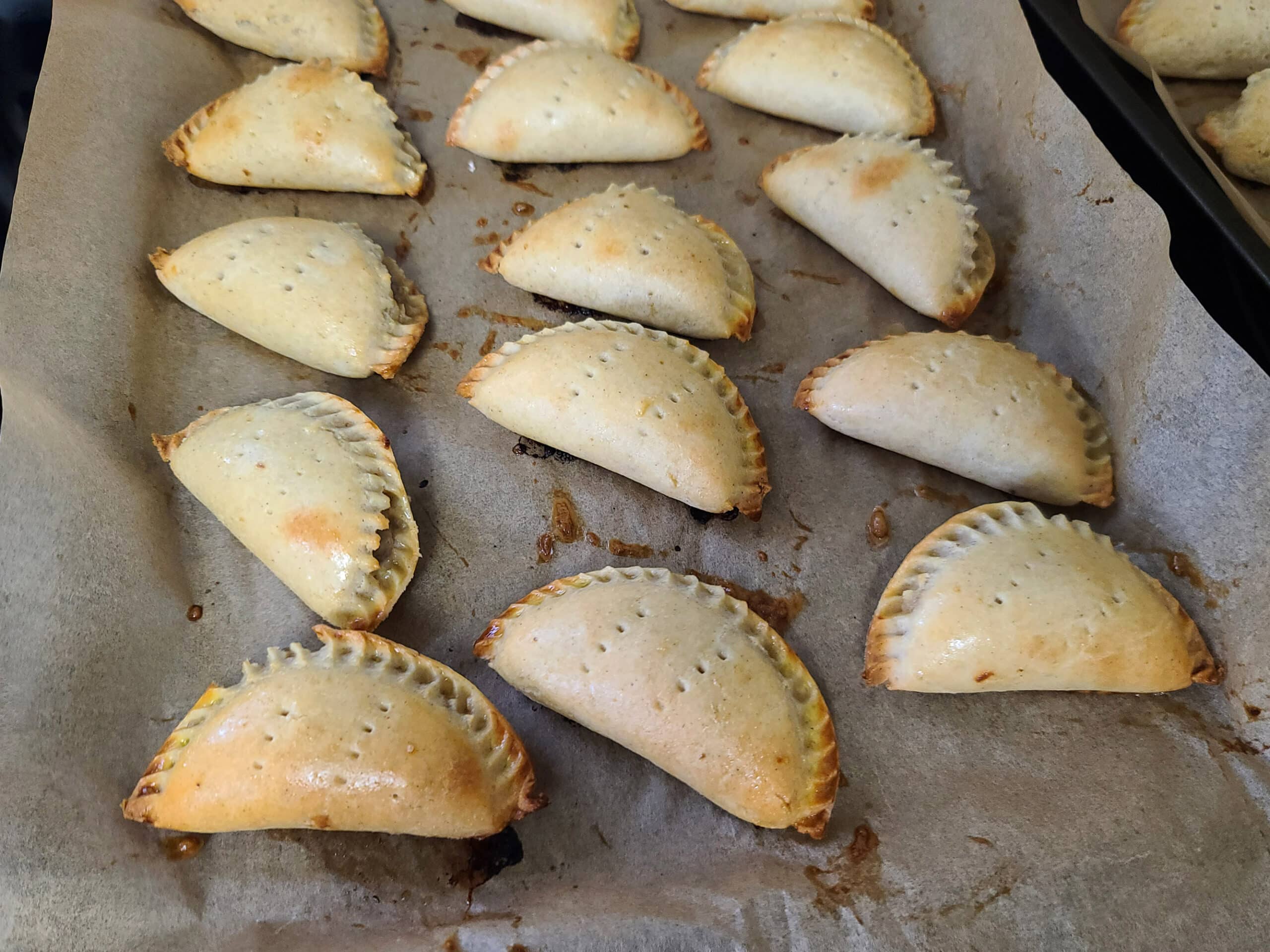 A pan of freshly baked gluten free mushroom turnovers.