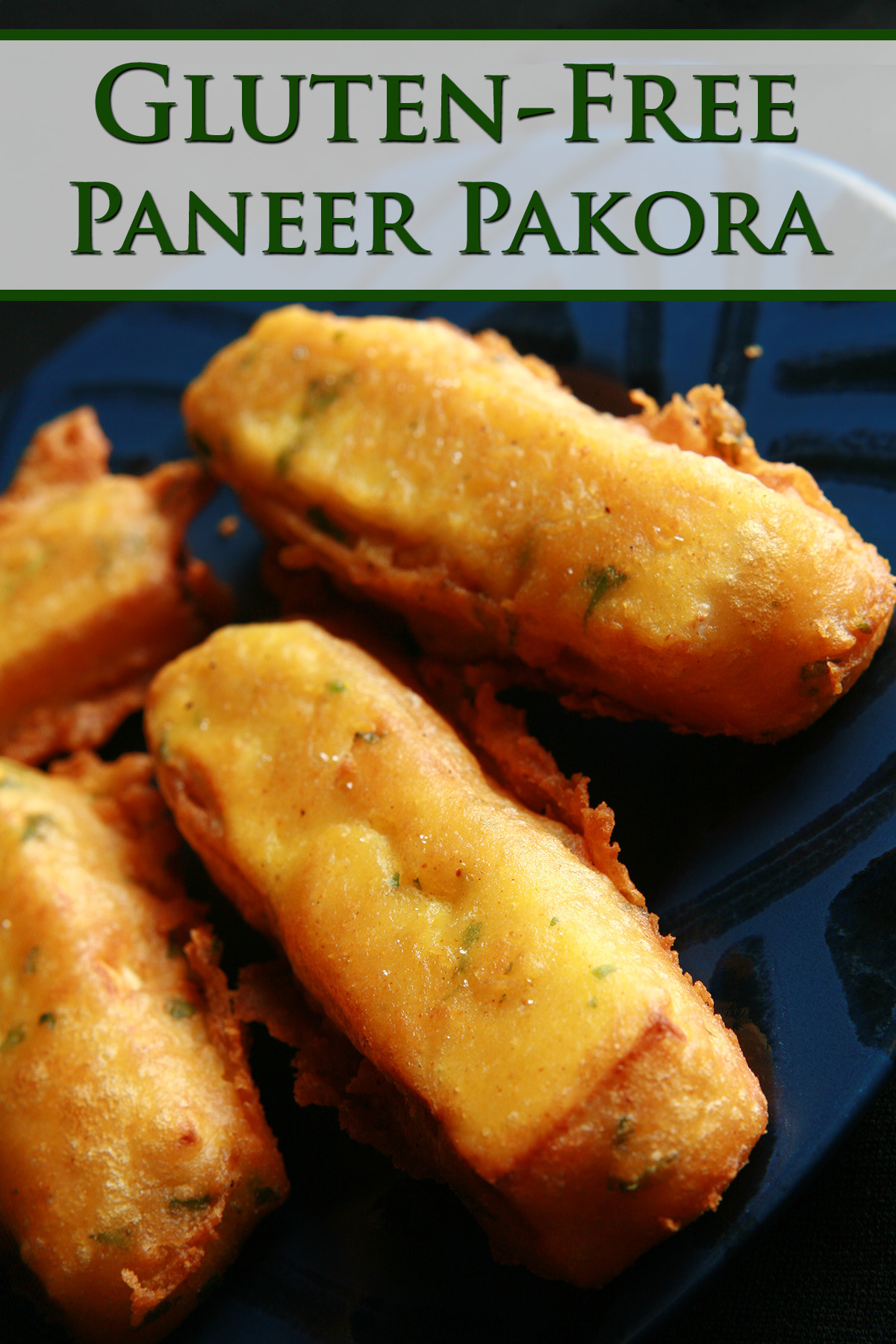 Several sticks of gluten-free paneer pakora - deep fried cheese sticks - on a blue plate.