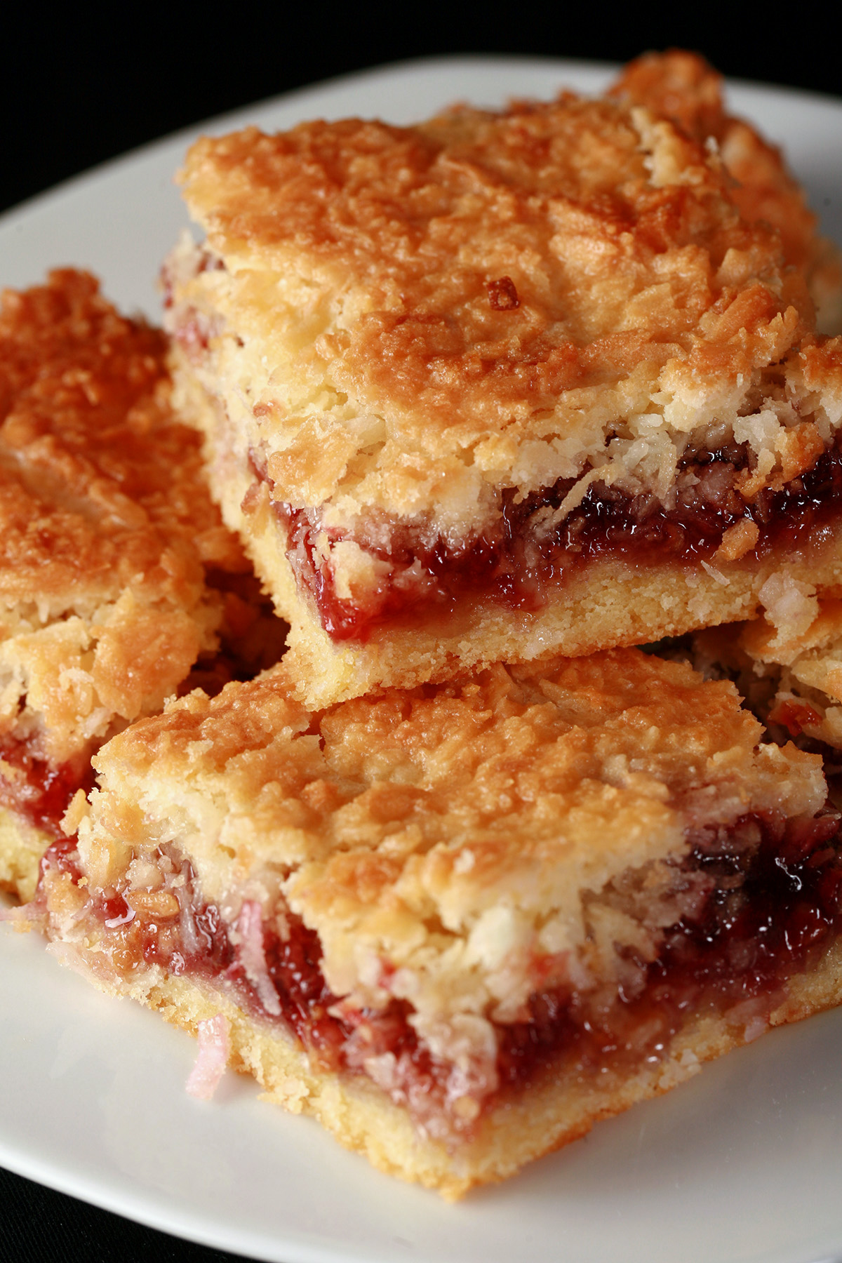 A plate of gluten-free raspberry coconut bars.