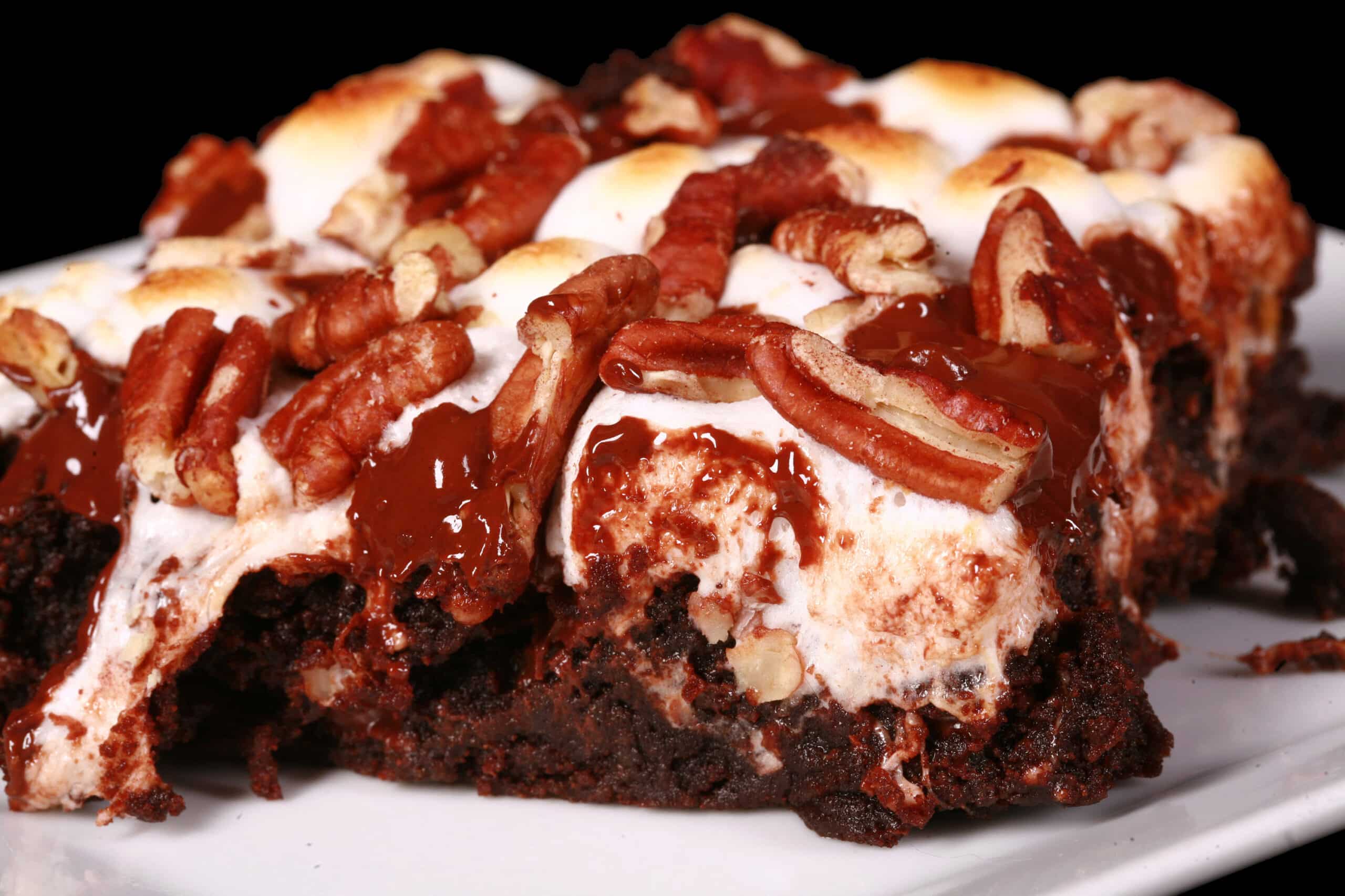 A gluten free rocky road brownie, topped with toasted mini marshmallows, pecans, and chocolate chips.
