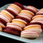 A mixed plate of gluten free sandwich cookies - lemon, chocolate, and vanilla.