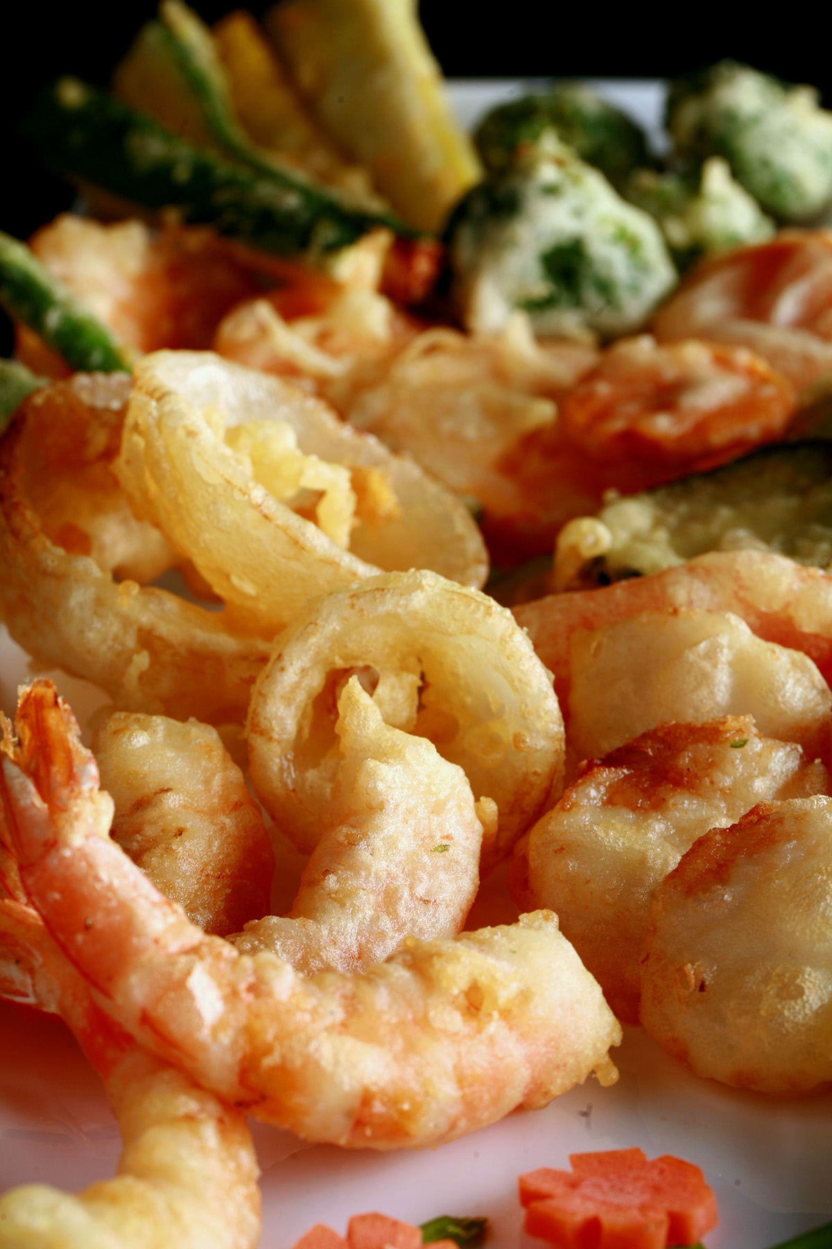 A tray of gluten free tempura shrimp and vegetables.