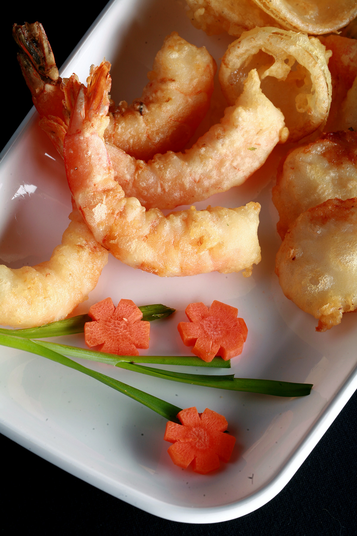 A tray of gluten-free tempura shrimp and vegetables.