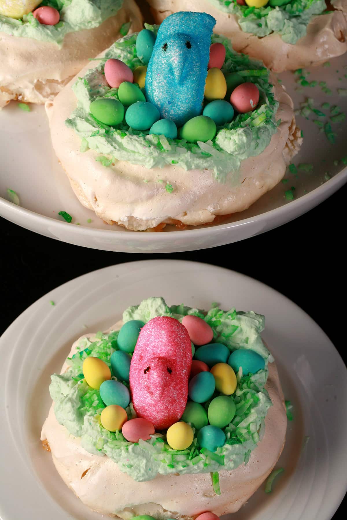 A trio of Easter themed mini pavlovas. Each is topped with mini chocolate eggs and a marshmallow peep.