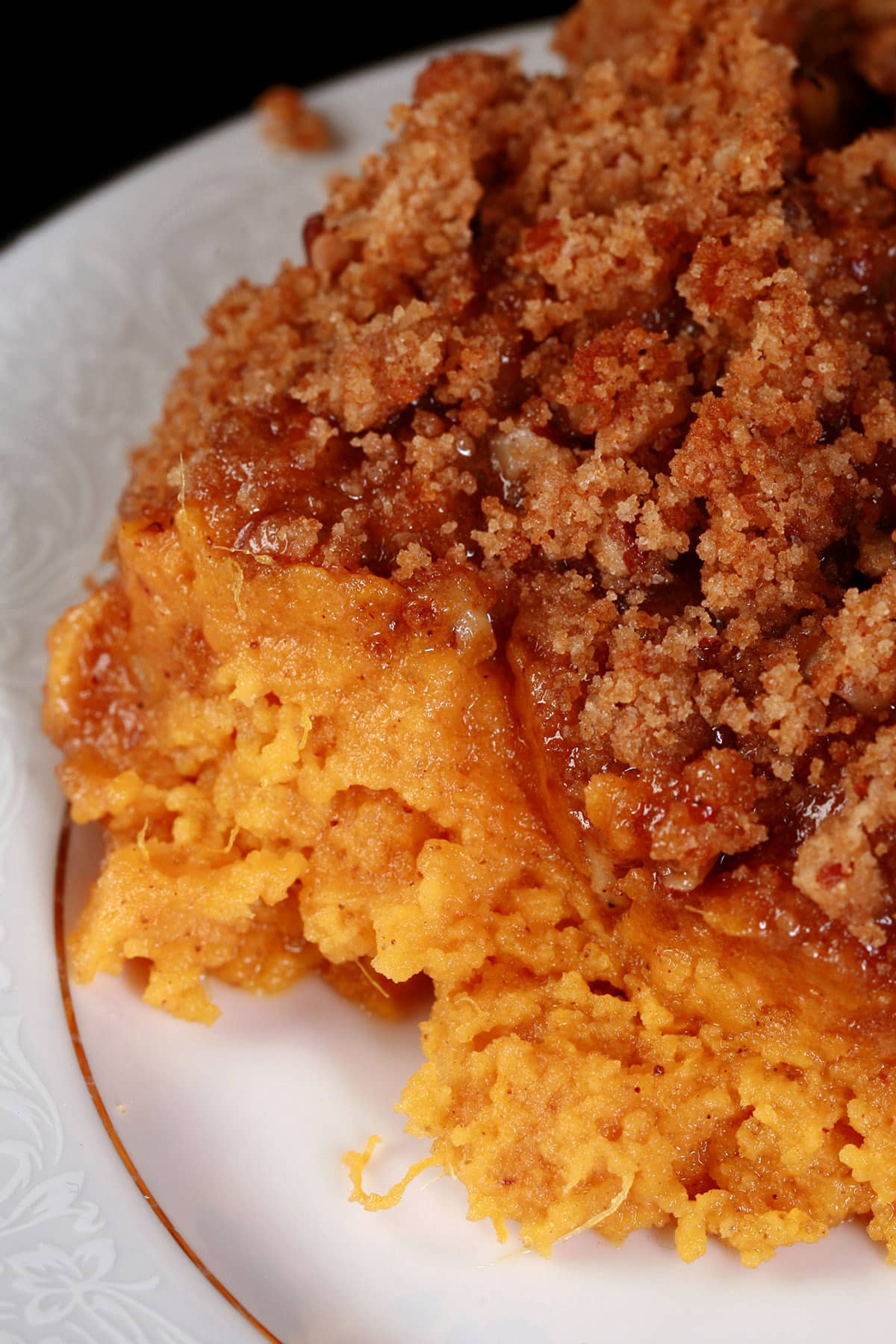A serving of sweet potato souffle on a dish.