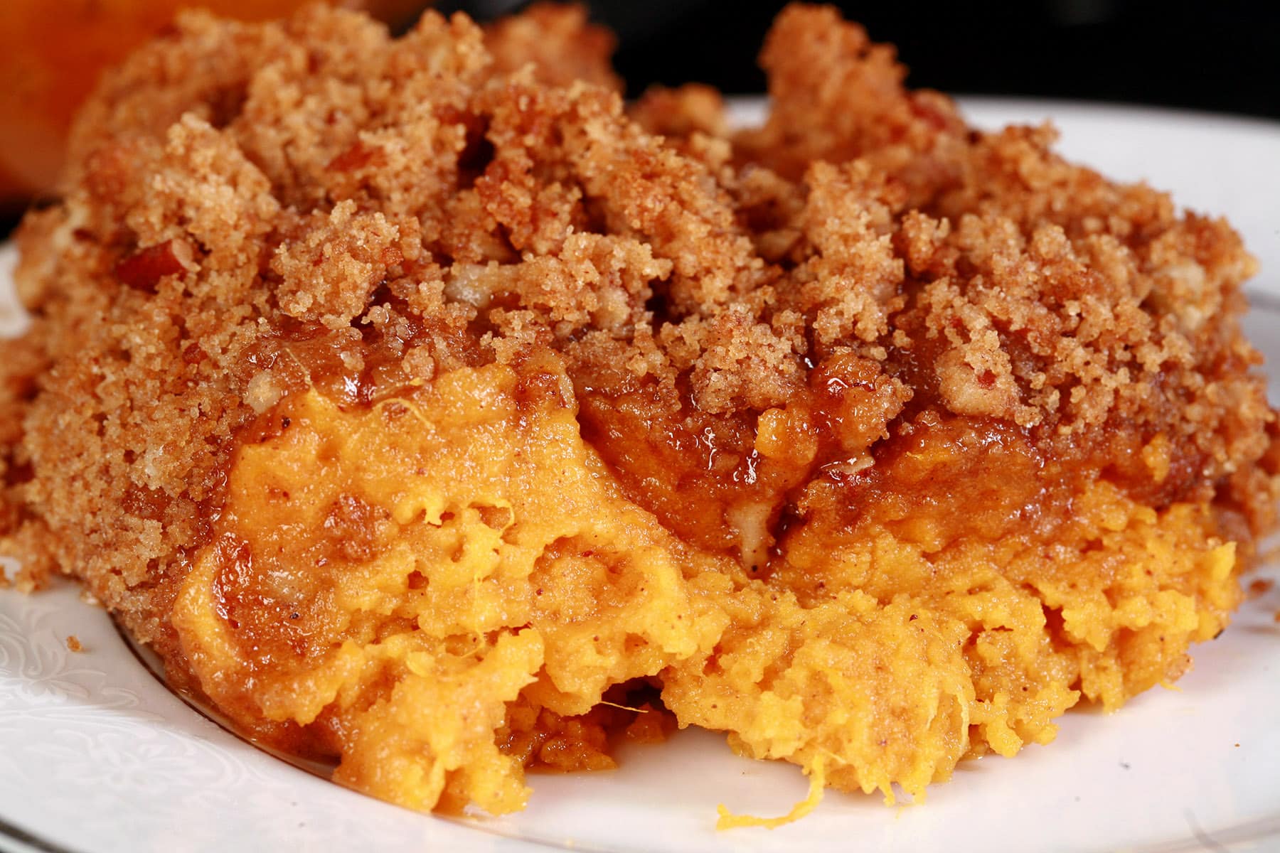 A serving of sweet potato souffle on a dish.