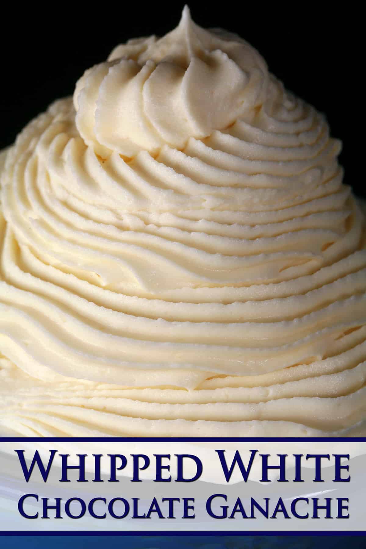 A tall swirl of whipped white chocolate ganache in a small bowl.
